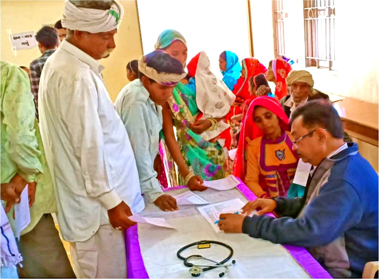 IMA GSB executive committee and local volunteers at Virampur camp.